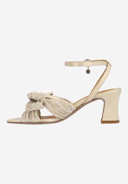Left side view of Olwen BEIGE PLEATED SATIN